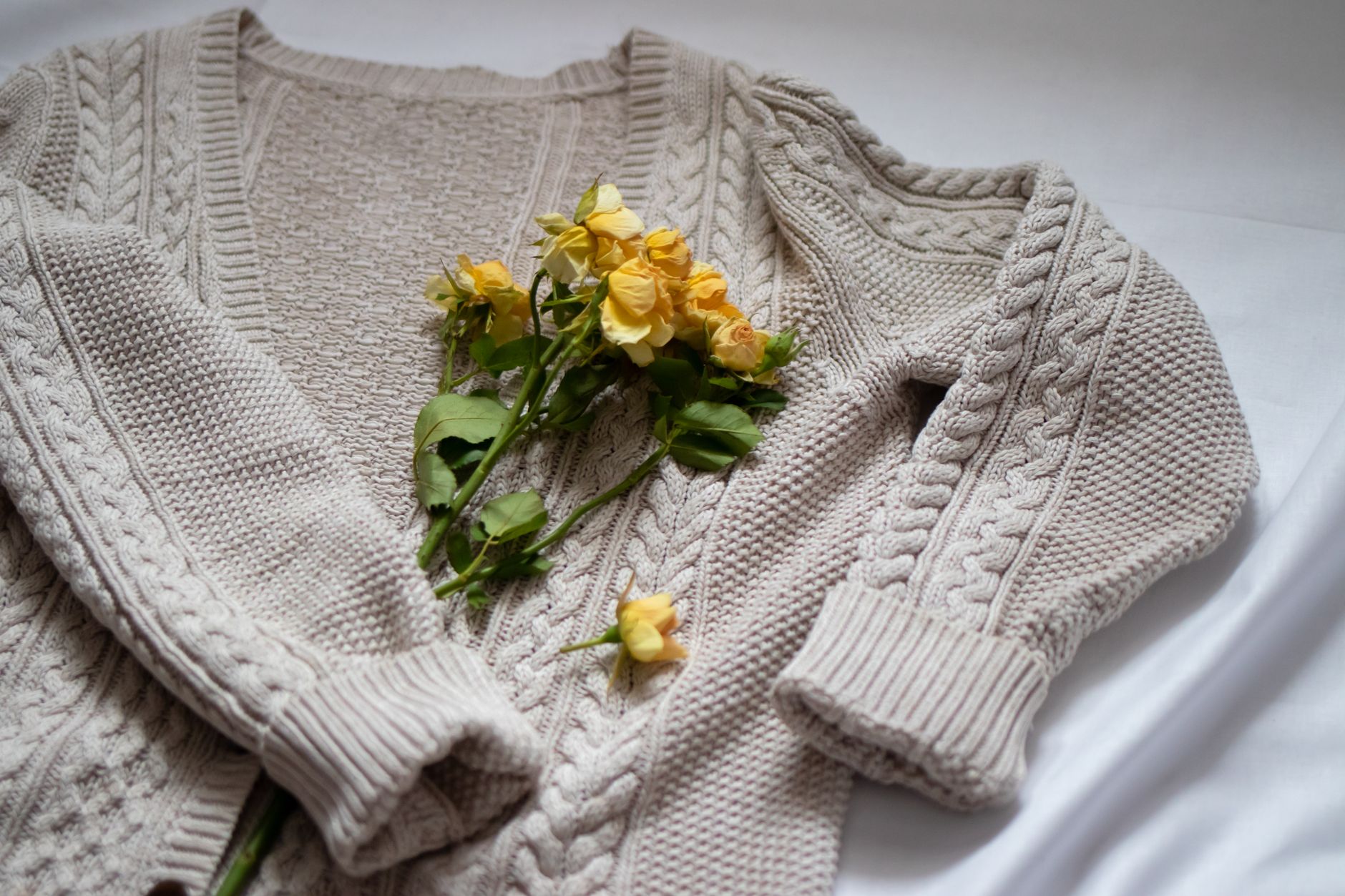 Close-up of structured knitwear with a high polo collar neckline