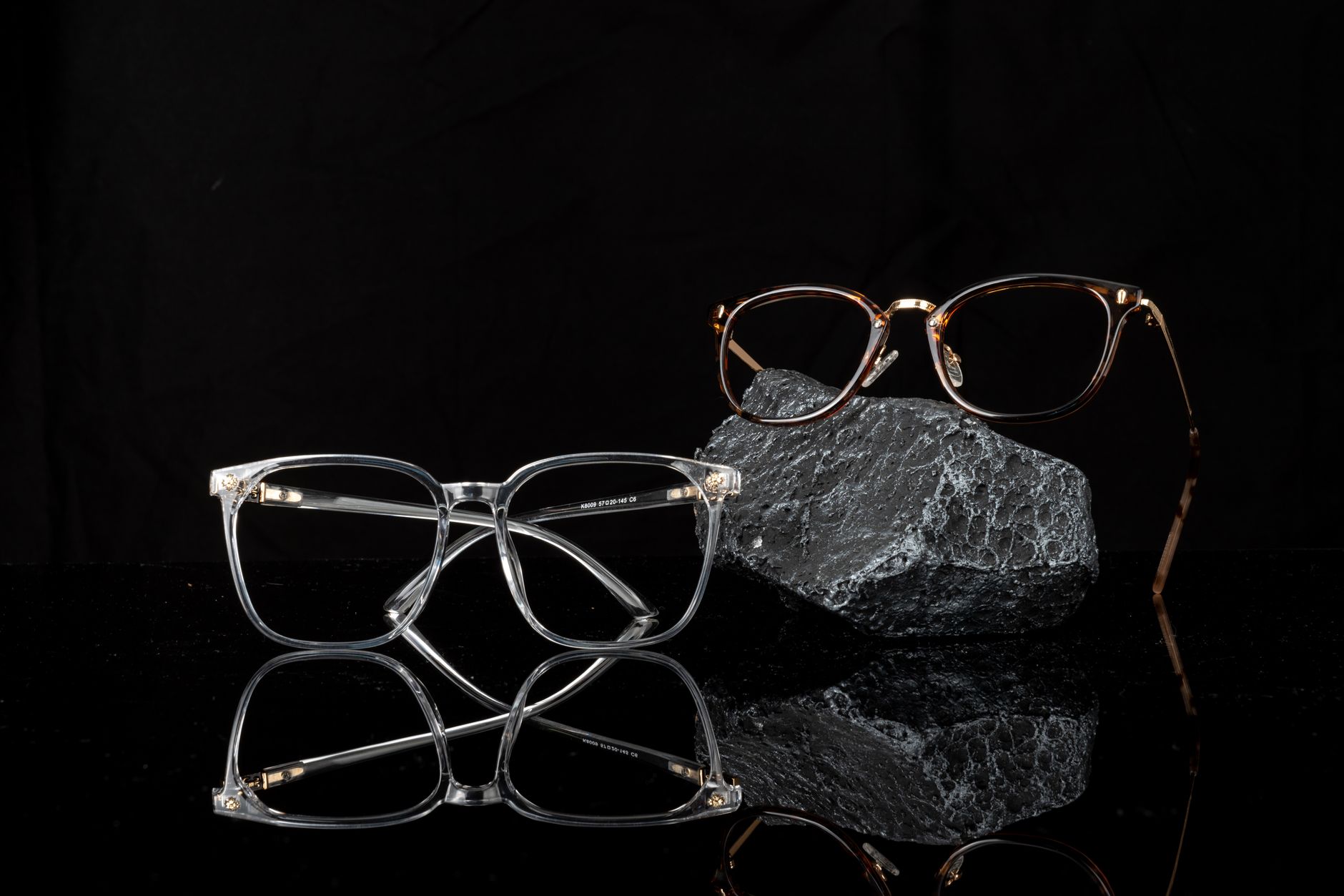 Close-up of wide-bridge acetate sunglasses with equestrian-style hardware detailing