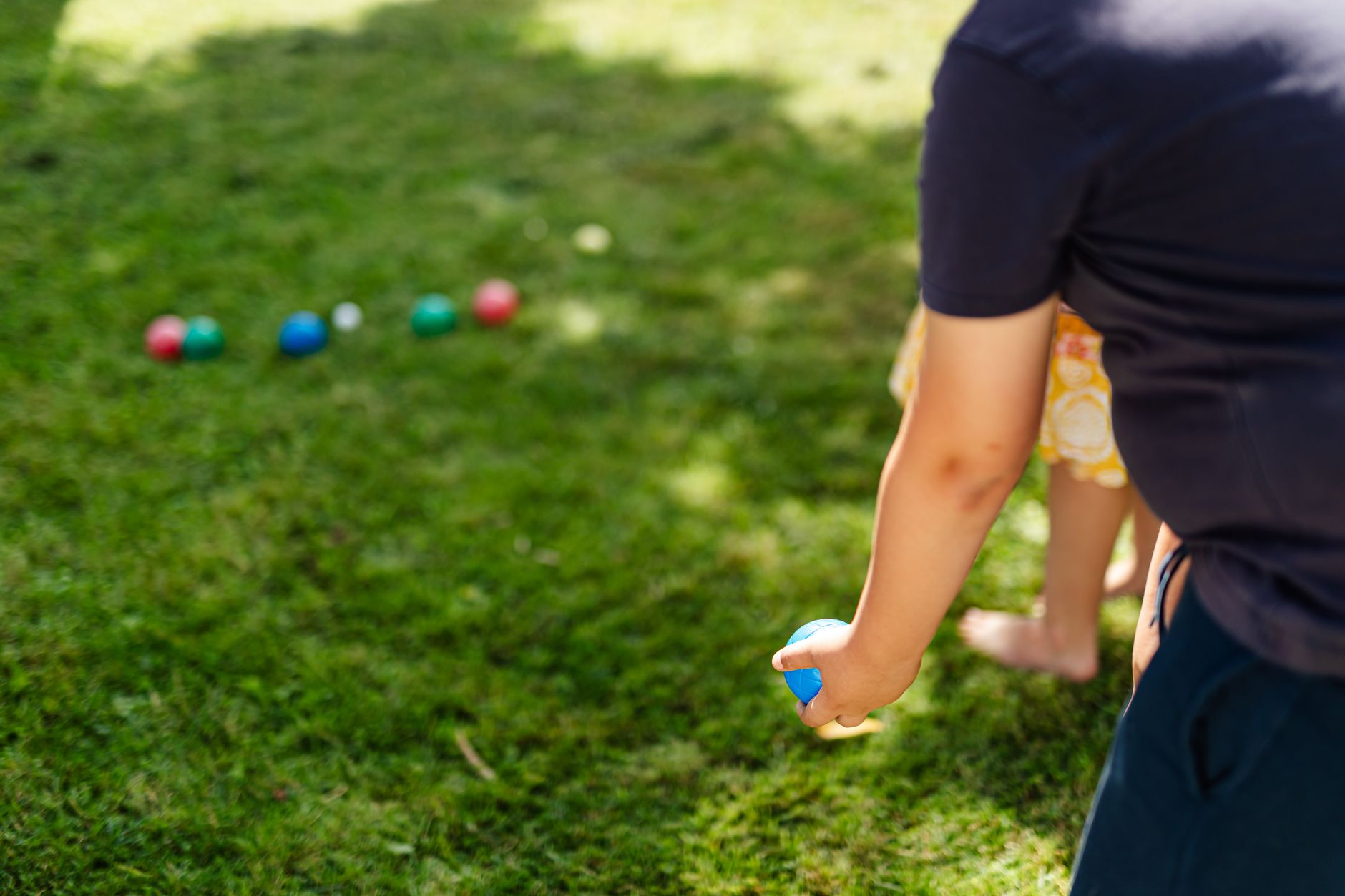 Traditional croquet wickets set in a manicured lawn, showing the arched metal form that inspires current accessory design