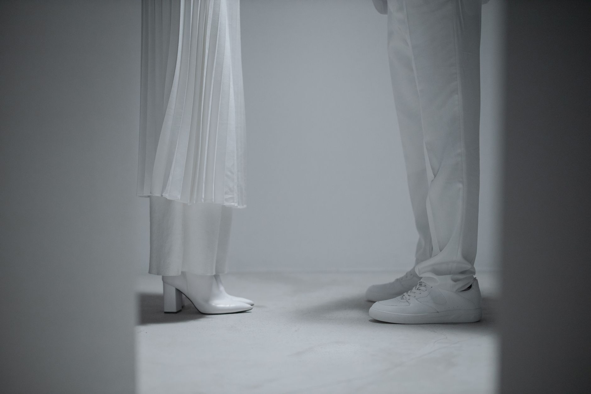 Clean white tailored separates styled with natural fabric accessories