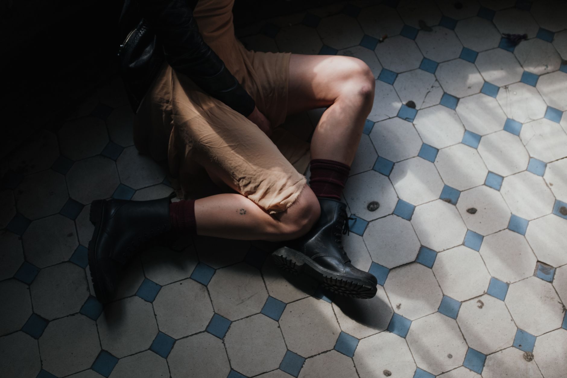 Close-up of wrapped ankle boots with layered bandage-style detailing