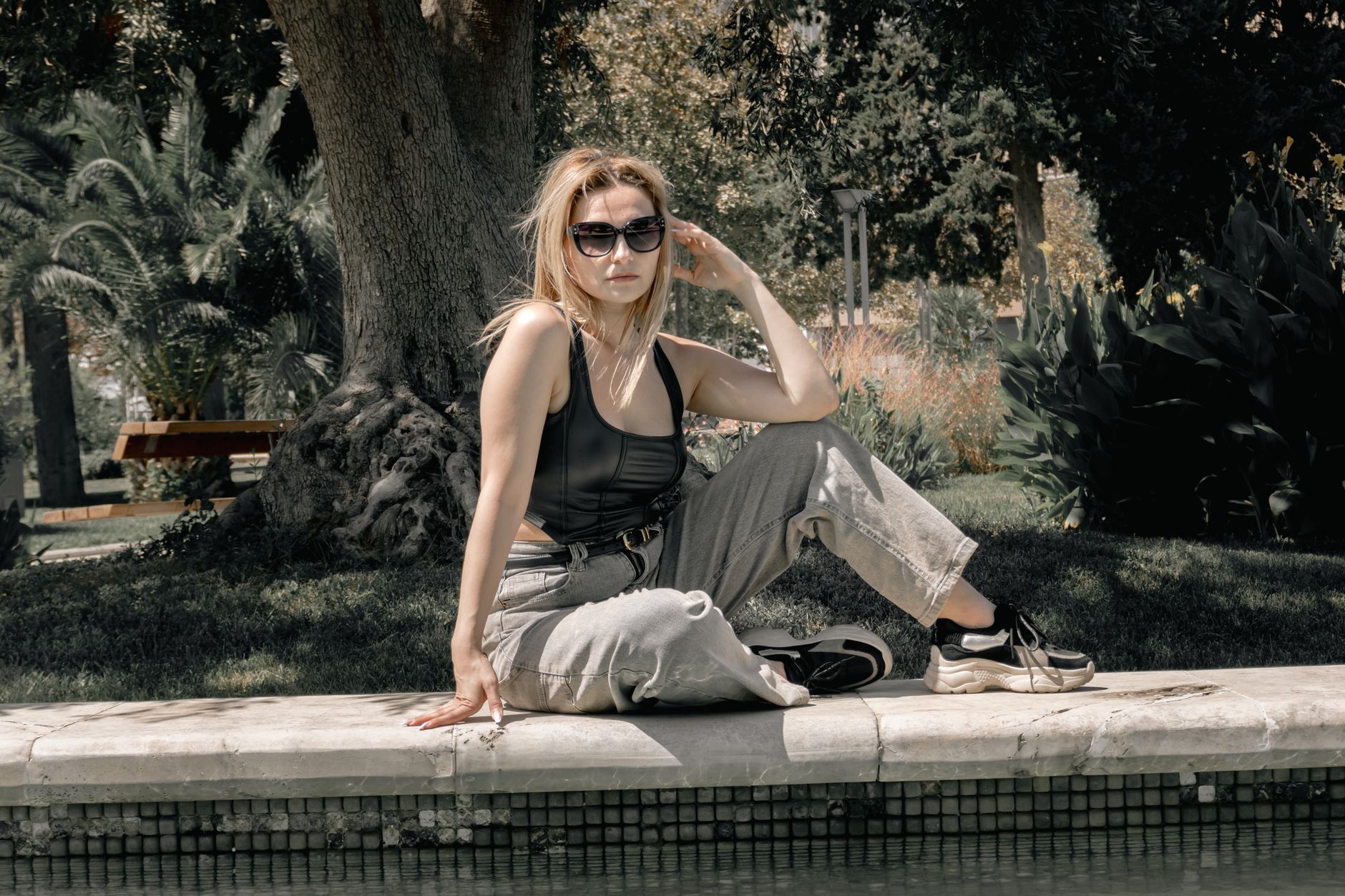 Relaxed street style outfit featuring statement sunglasses paired with denim and loafers