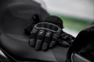 Close-up of tan cabretta leather polo riding gloves with snap closure detail