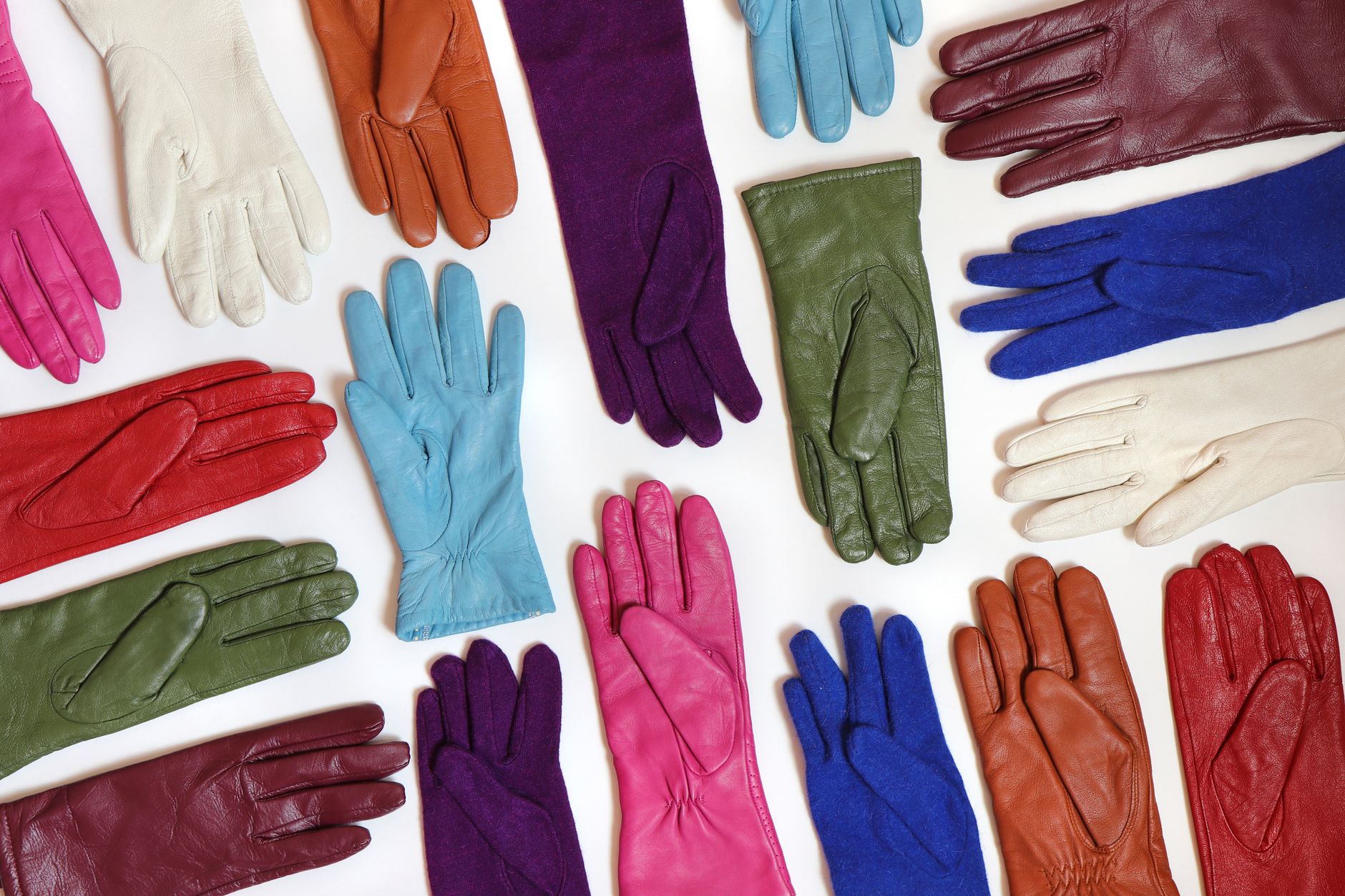 Close-up of structured leather gloves with open-back construction and reinforced palm panels