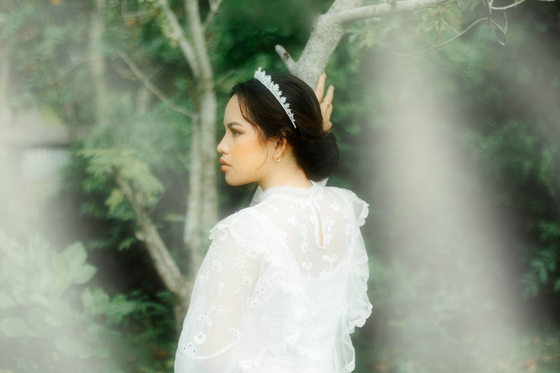 Fine mesh hair net accessory resting on gathered hair at the nape of the neck