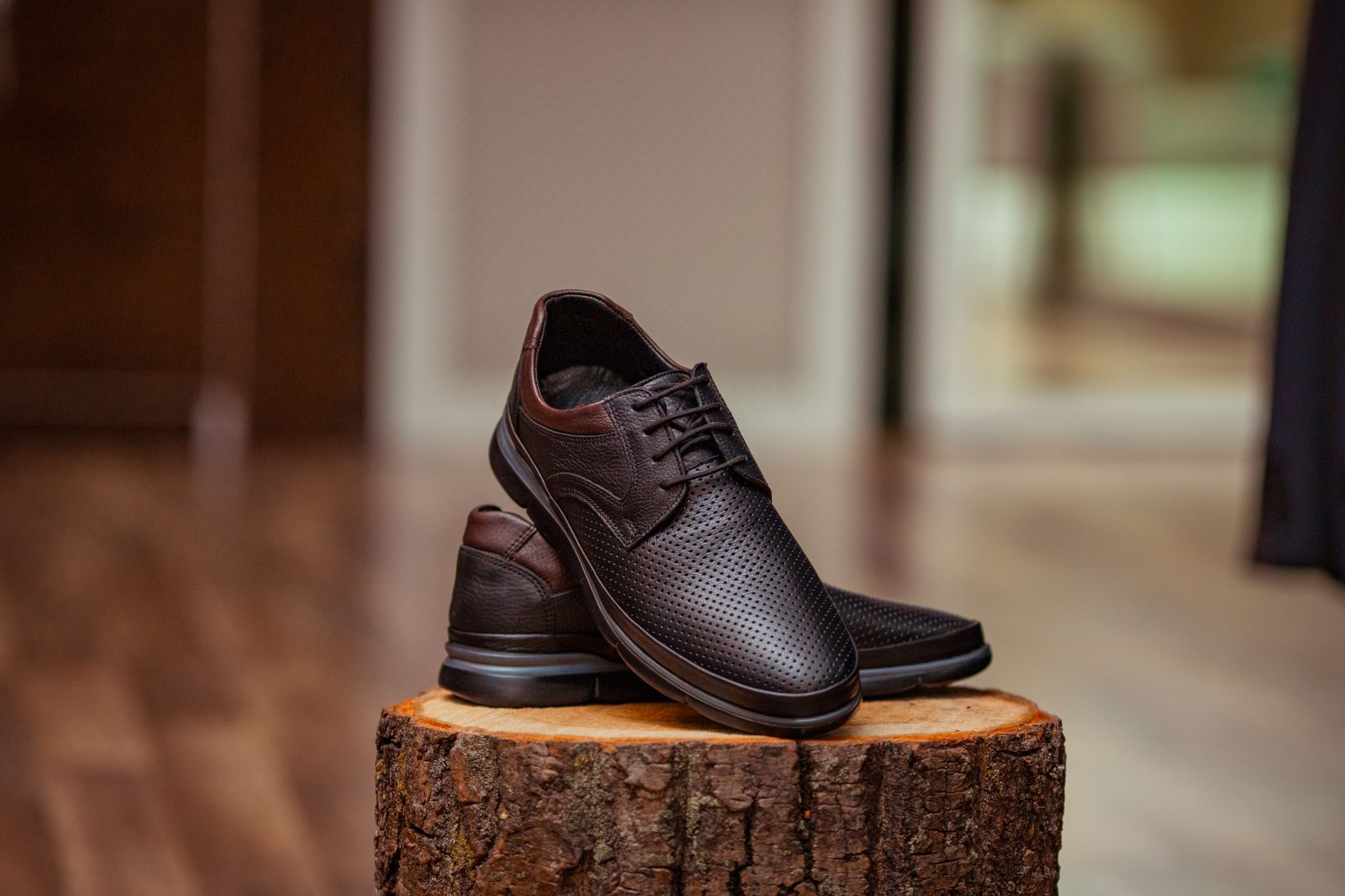 Pair of high-quality leather boots on a clean studio surface