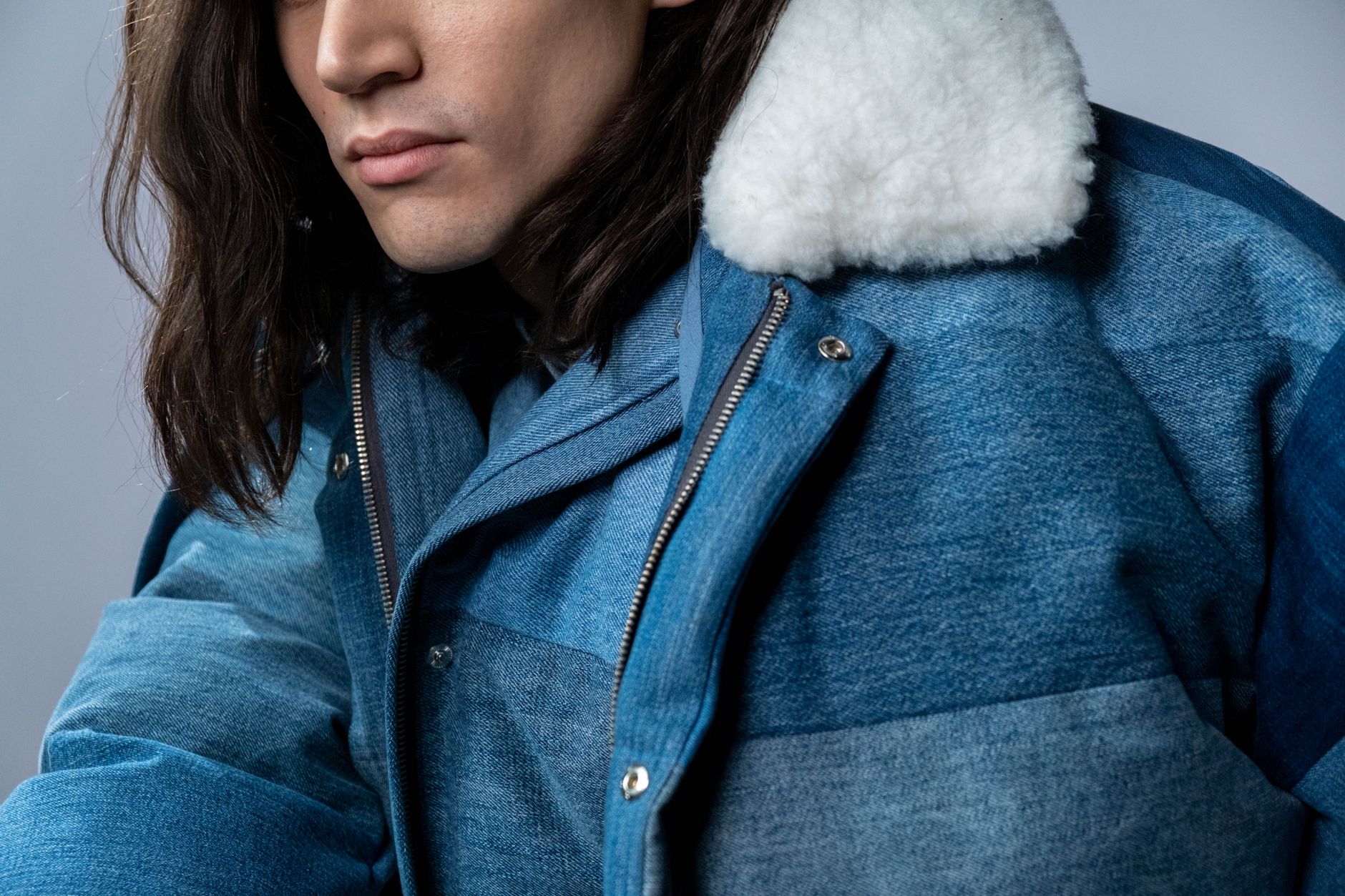 Detail shot of a structured luxury coat with padded shoulder construction