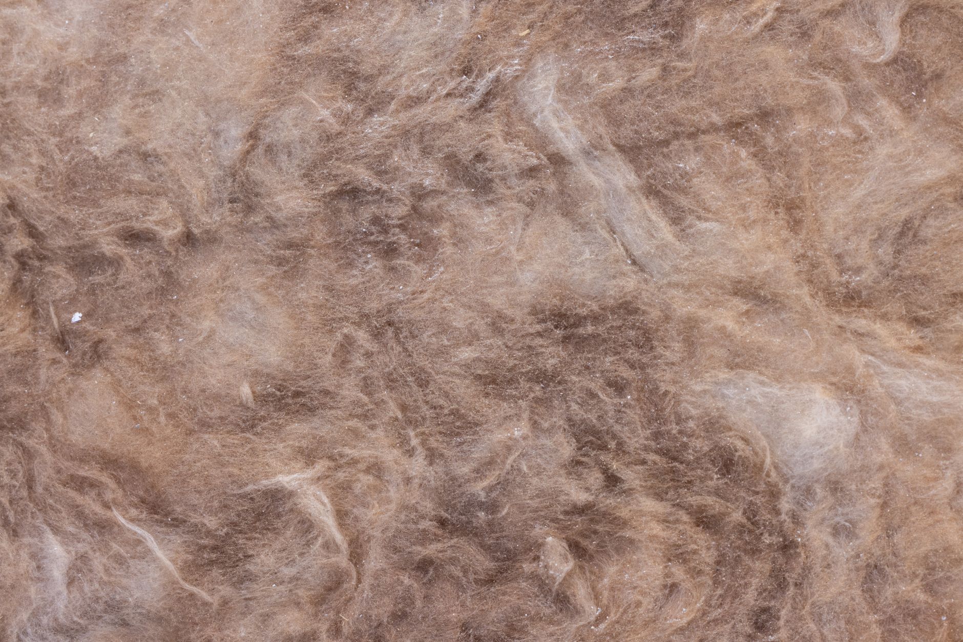 Close-up of heavy woven fabric in deep navy, showing the texture and weight associated with luxury loungewear construction