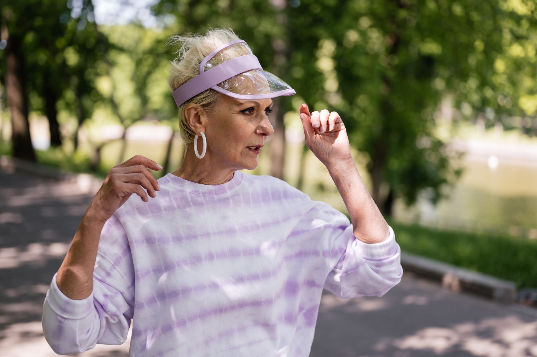 Sculptural fashion visor with geometric bar construction inspired by protective headwear