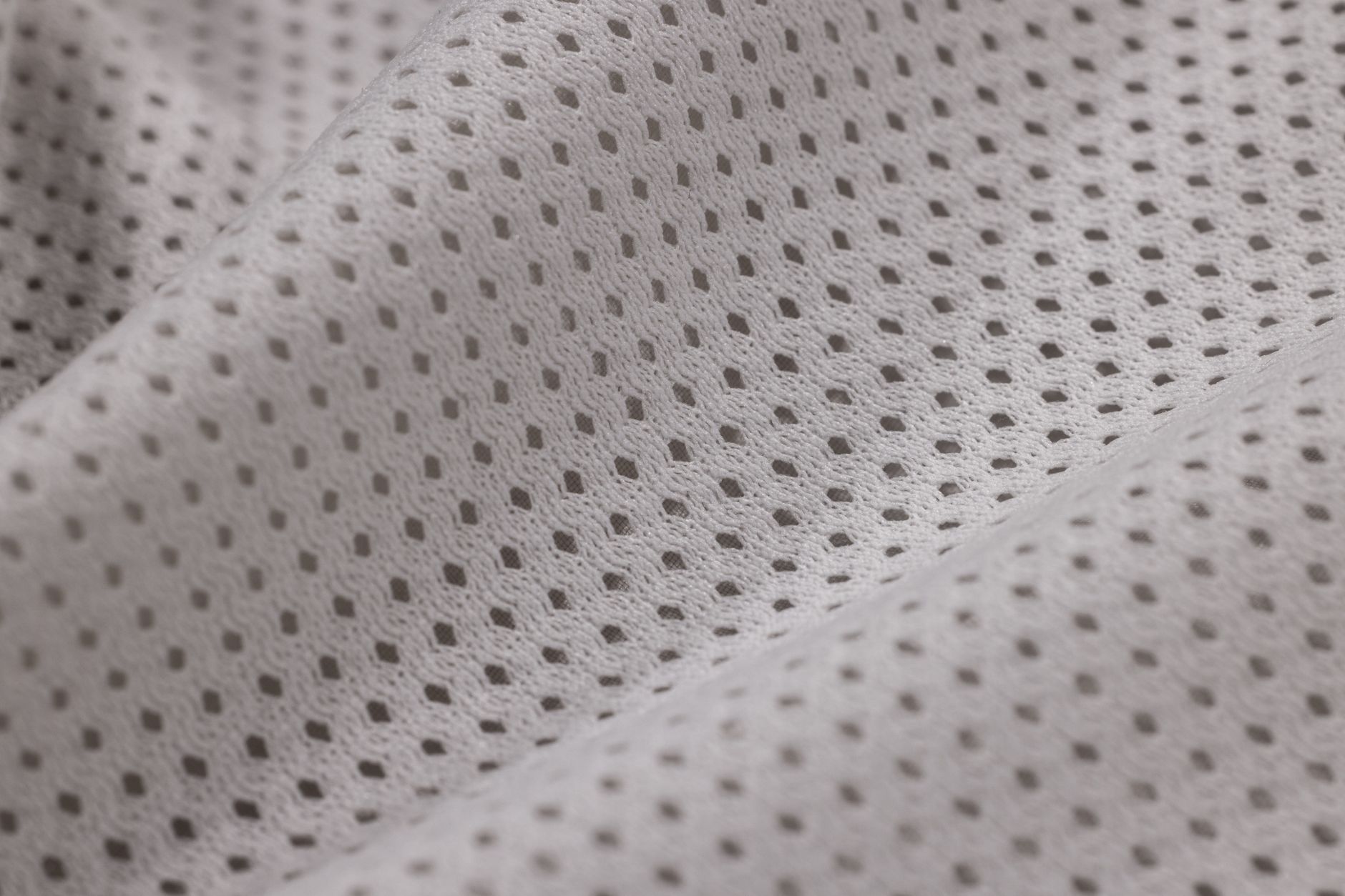 Detail shot of whipcord fabric weave showing raised diagonal ribbing and wool texture