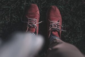 Close-up of knee-length dress socks with a narrow elastic leg band visible below a trouser hem