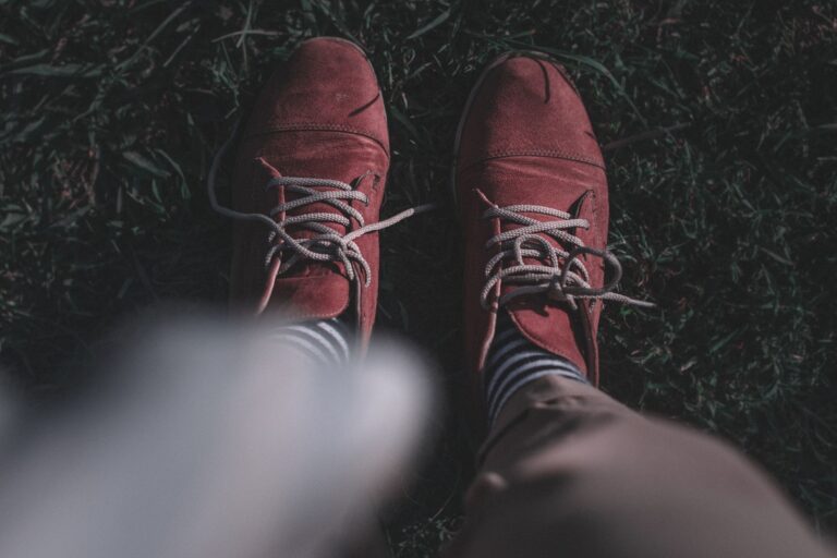 Close-up of knee-length dress socks with a narrow elastic leg band visible below a trouser hem