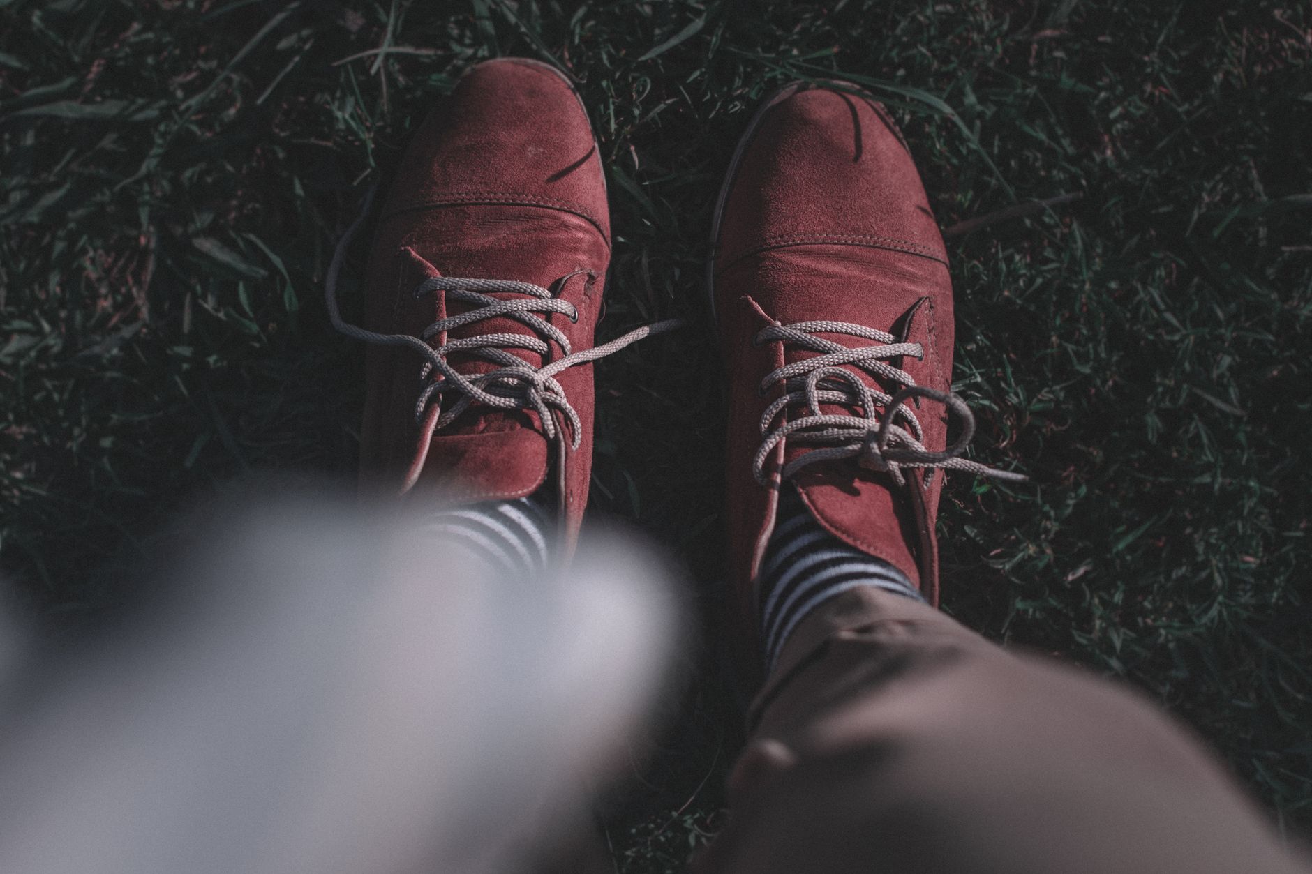 Close-up of knee-length dress socks with a narrow elastic leg band visible below a trouser hem