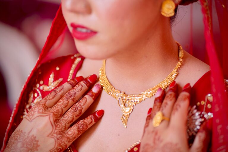 Close-up of minimalist red enamel ring on a neutral background
