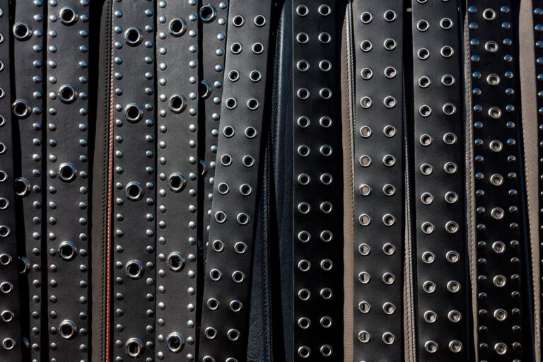 Polo Club Tail Guard Buckles Are Quietly Pressing Into Structured Belt Hardware Close-up of a structured leather belt with antique metal buckle hardware