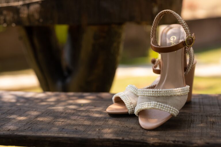 Polo Club Spur Straps Are Quietly Buckling Into Minimalist Ankle Bands Close-up of a narrow leather strap with a small roller buckle worn around a bare ankle