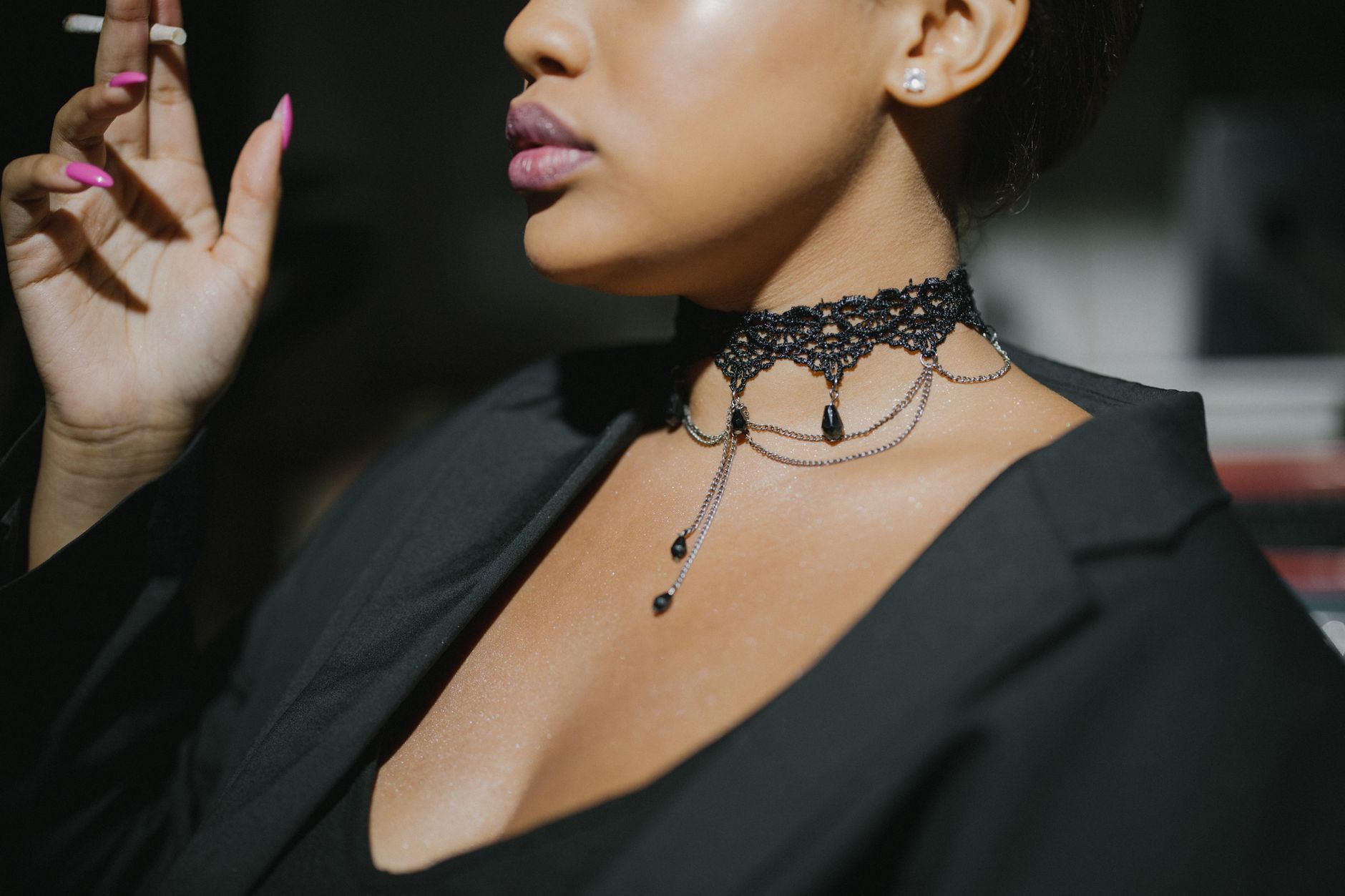 Minimalist sterling silver choker with geometric loop detail worn against bare neck