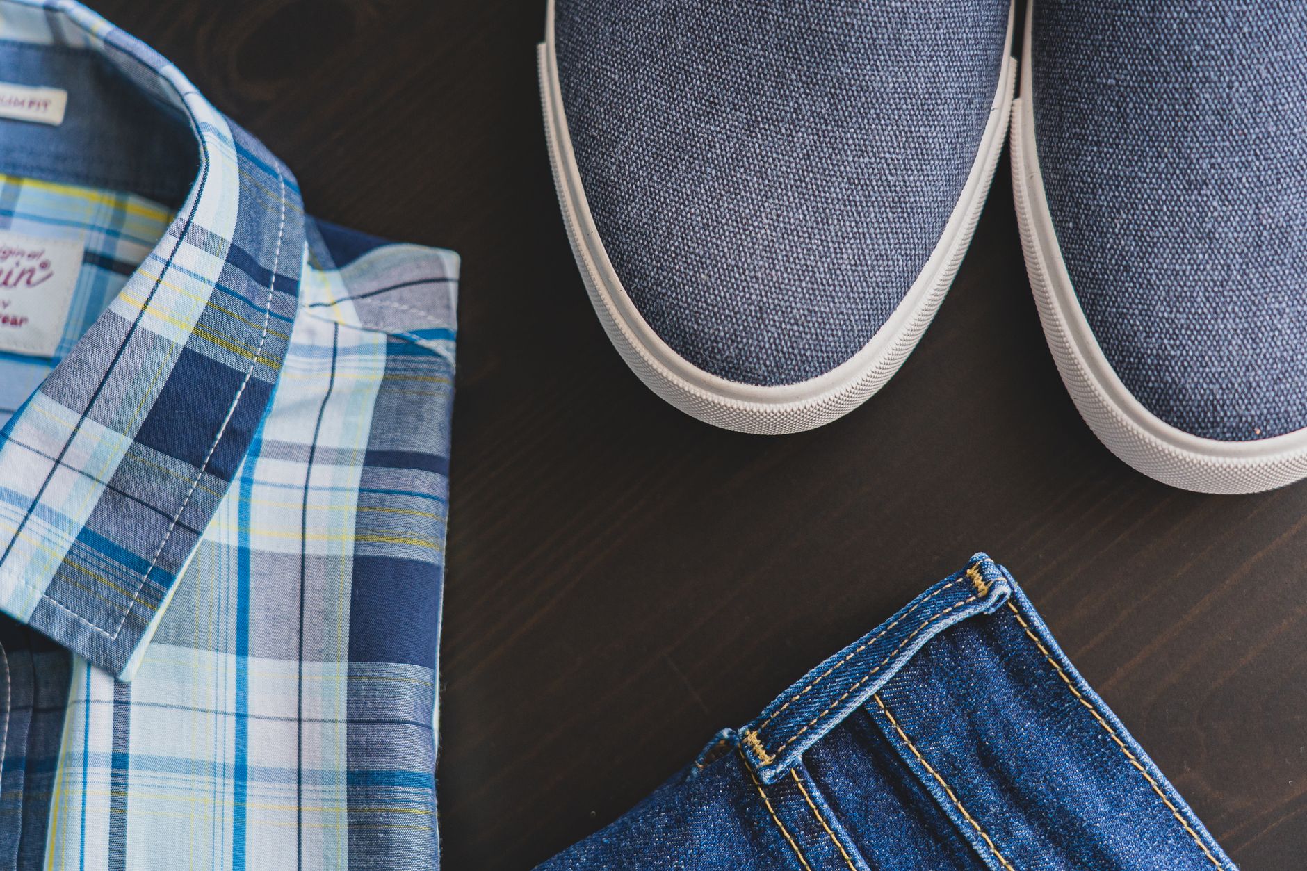 Heavy wool flannel trouser fabric with visible construction detailing and hardware fastening