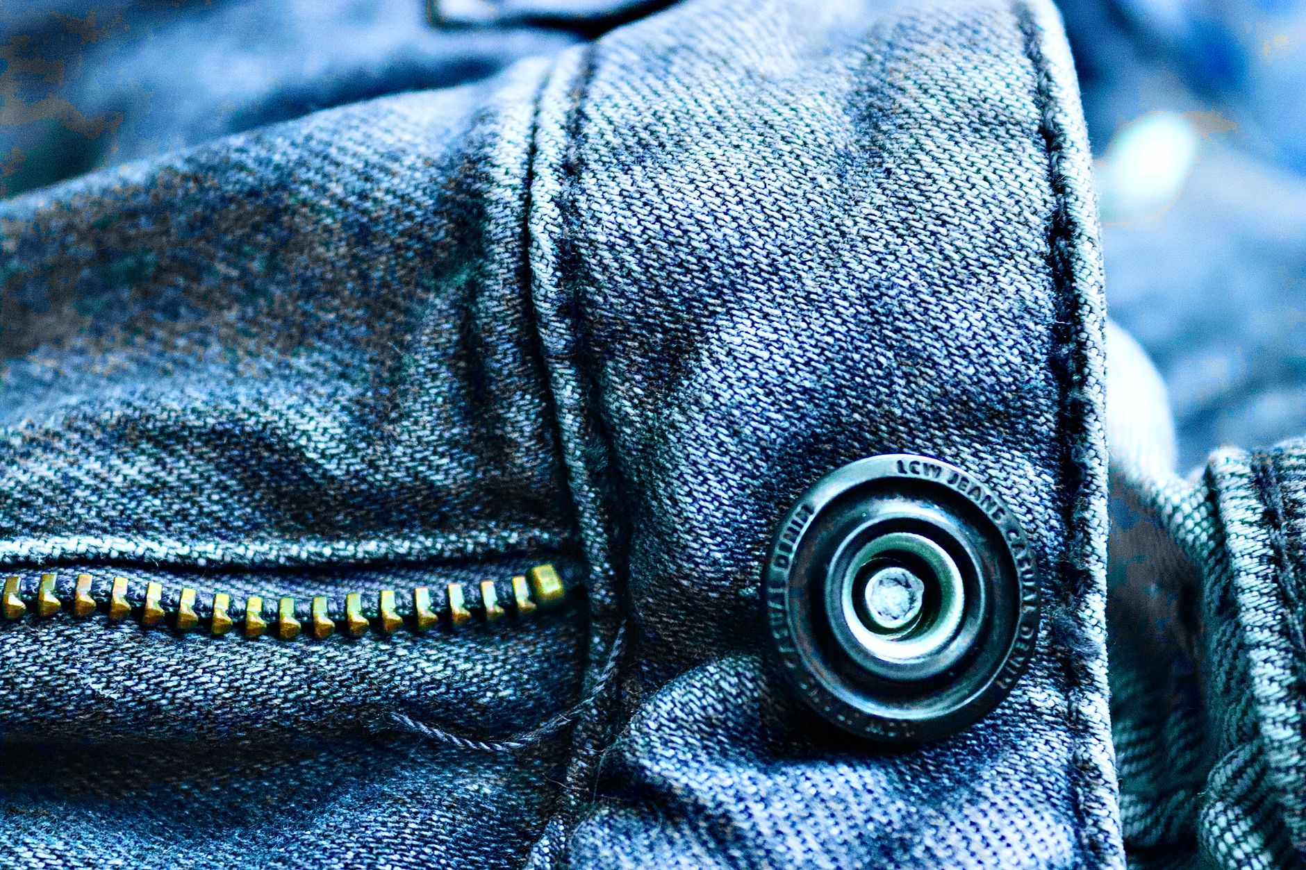 Detail shot of shirt collar fastening hardware on a formal white shirt