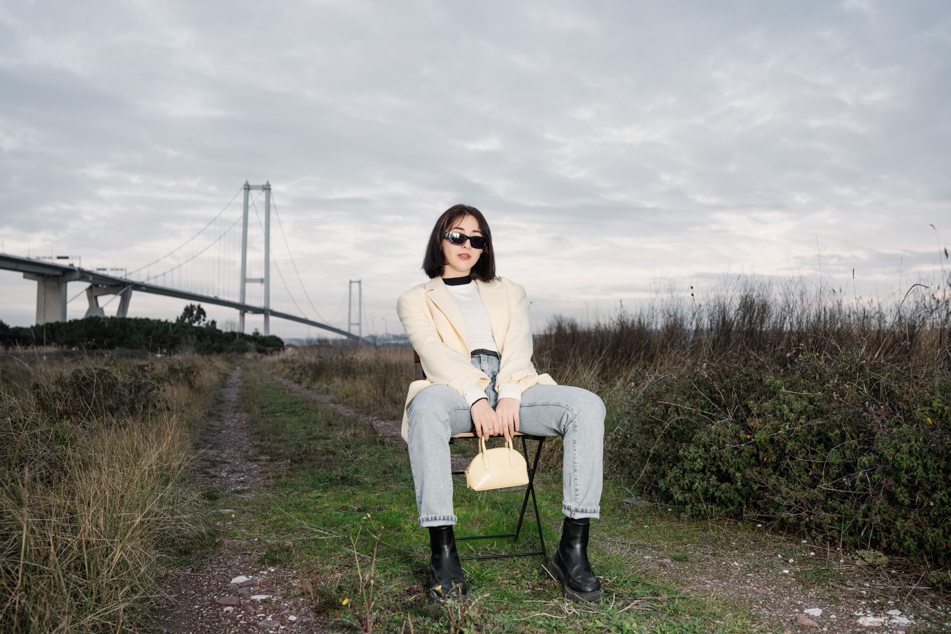 A structured frame handbag with an arched top opening displayed against a neutral background