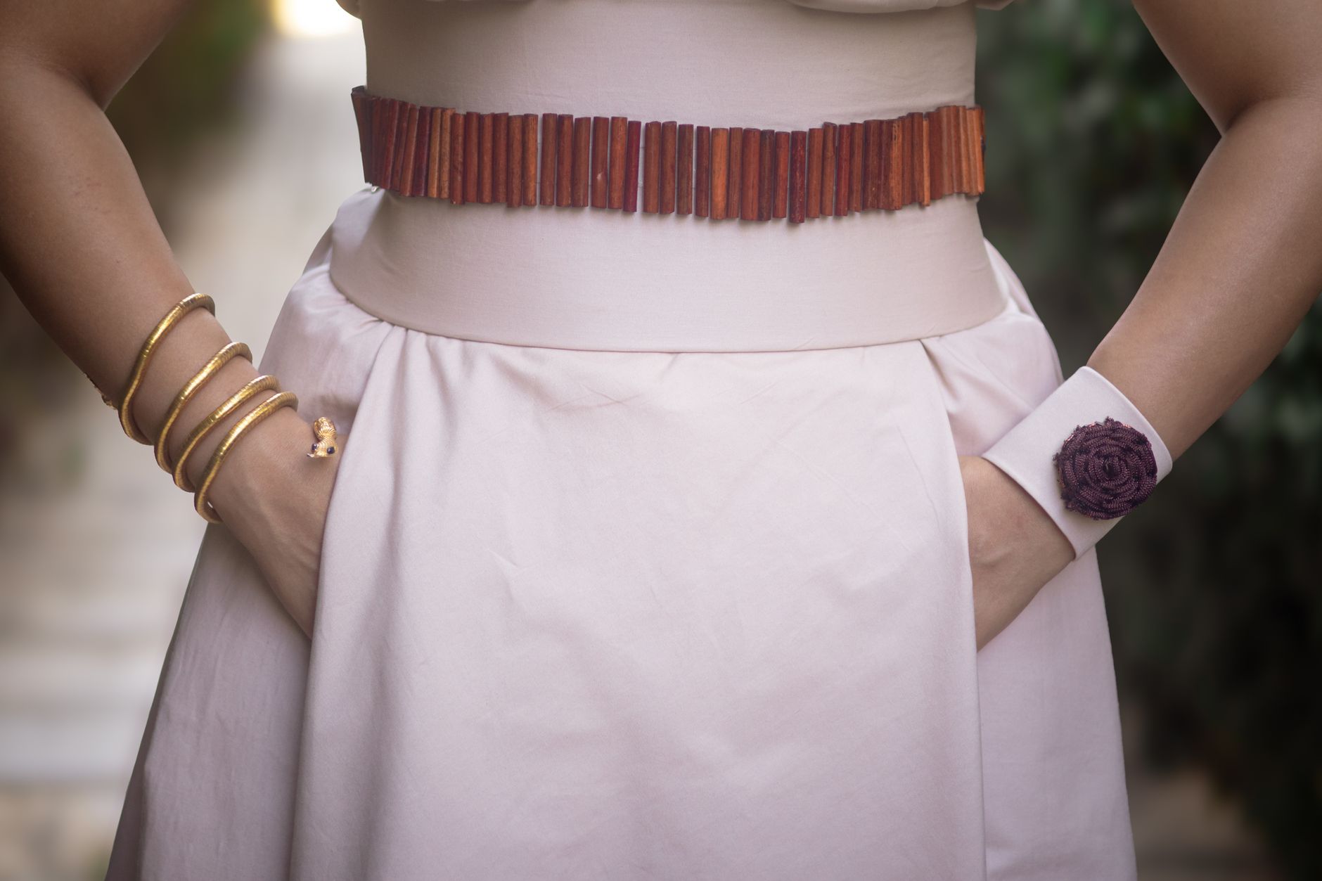 Oxidized brass cuff bracelet with a flat rectangular closure detail on a wrist