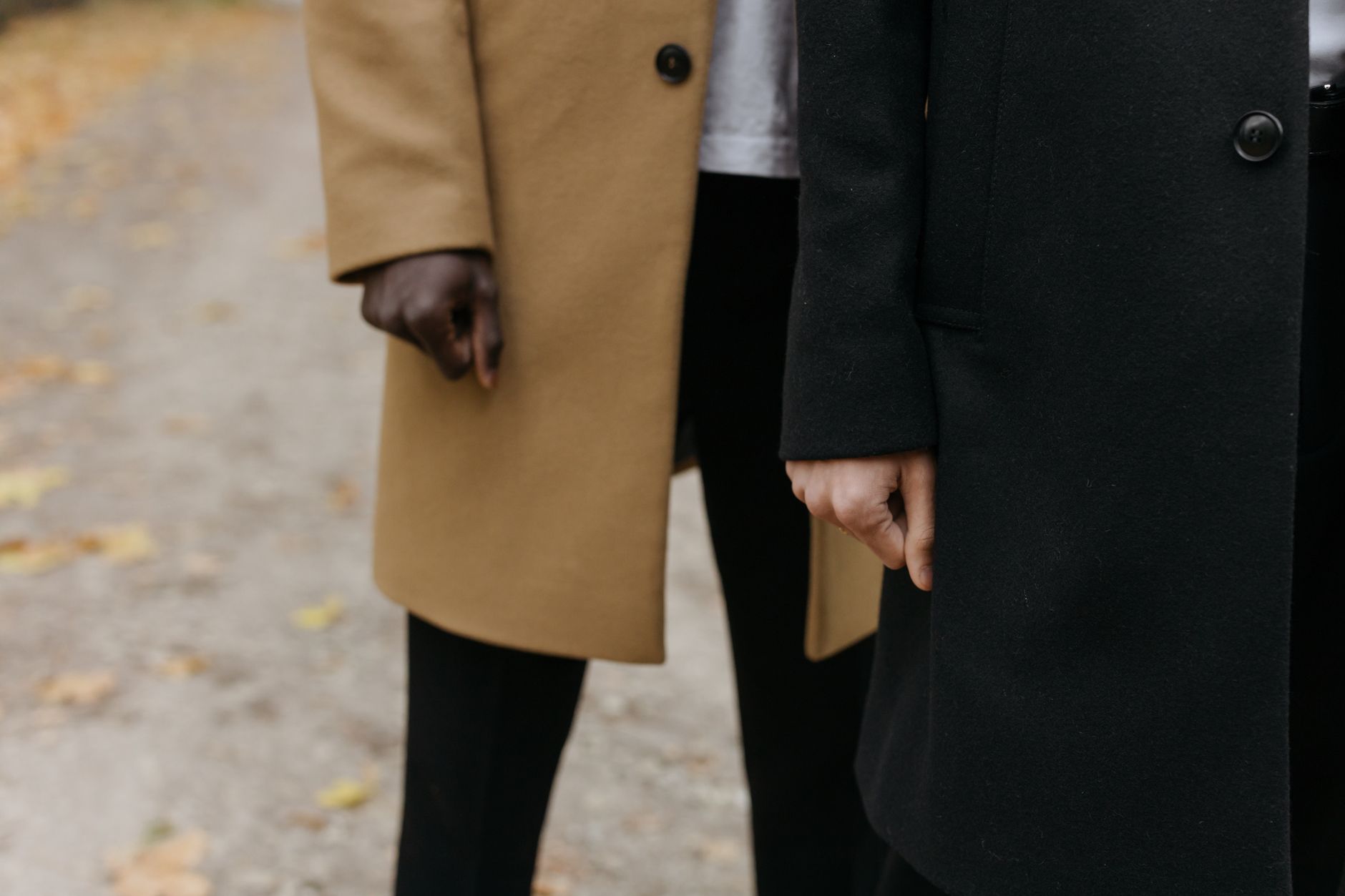 Detail shot of piped seam on a structured overcoat showing clean contrast edge stitching