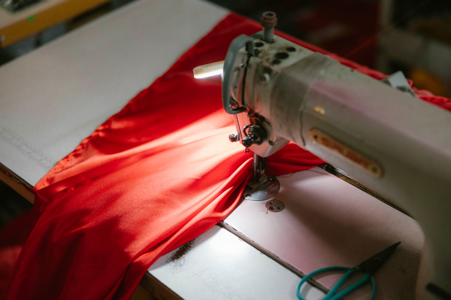 Close-up of a structured skirt hem with narrow binding tape finish inspired by equestrian construction