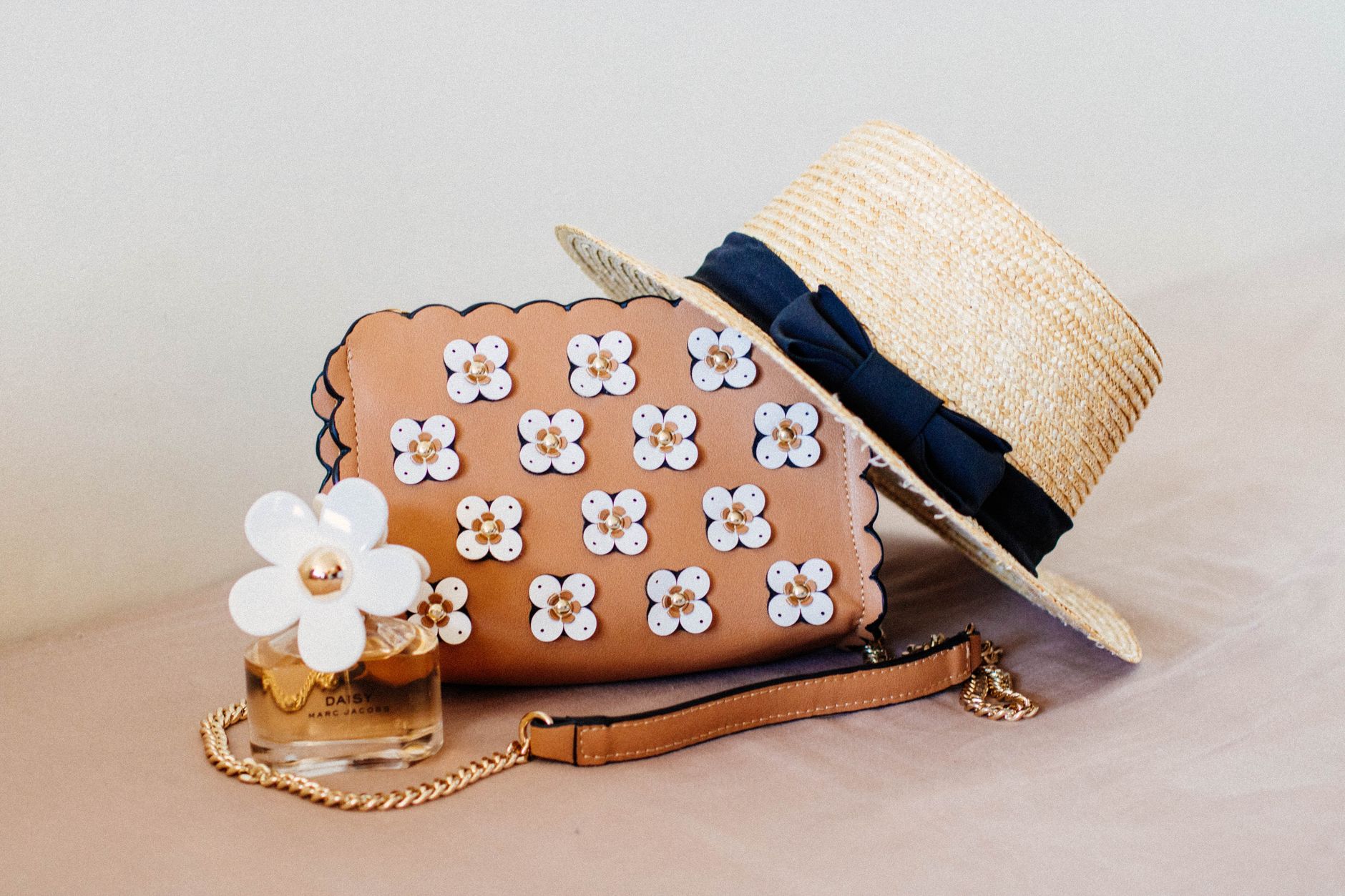 Curated leather accessories in cognac and tan tones arranged on a clean surface