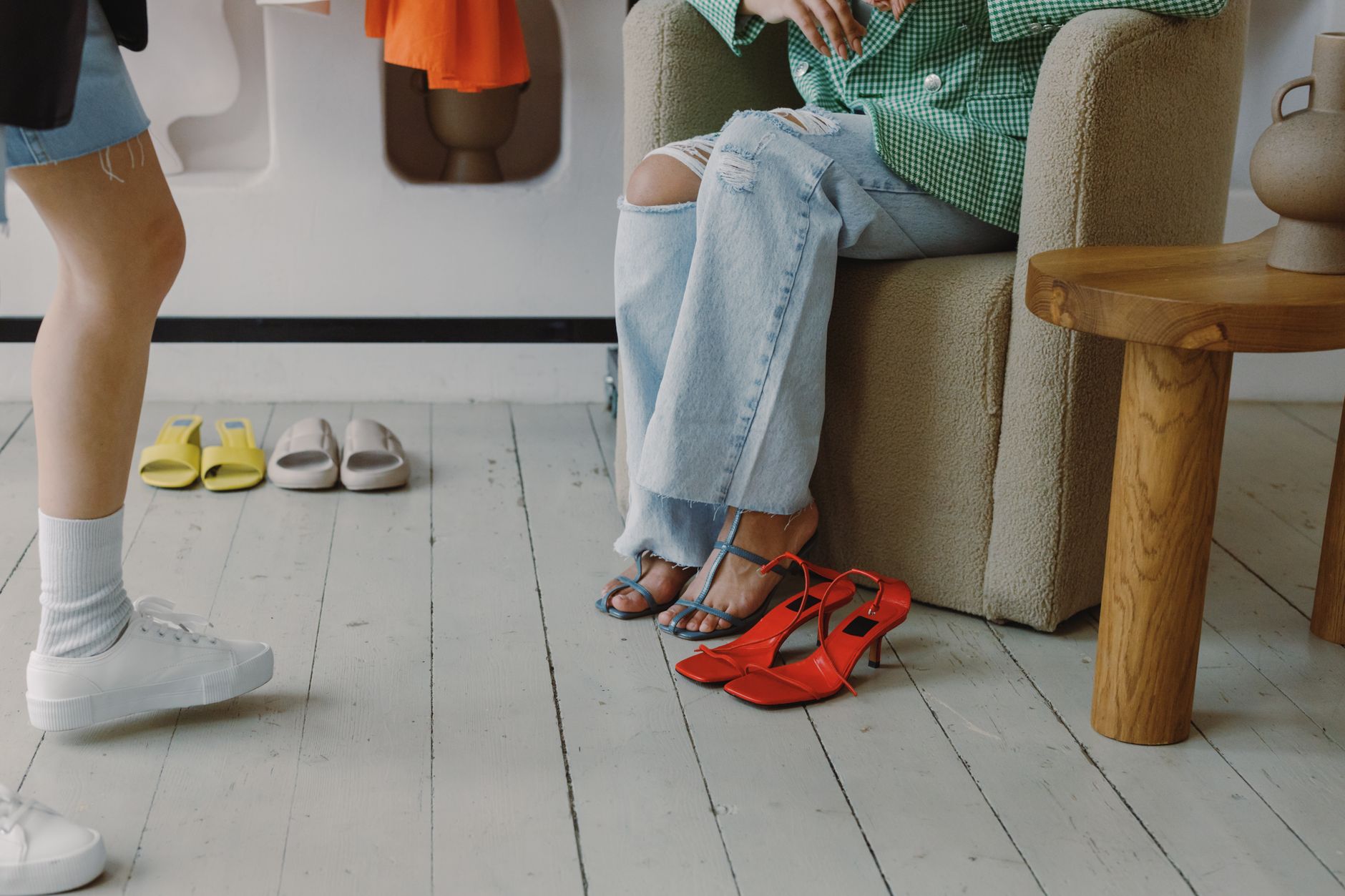 Styled fashion footwear shot featuring architectural boot silhouettes in a studio setting
