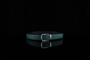 Close-up of a structured minimalist leather belt with clean hardware detail