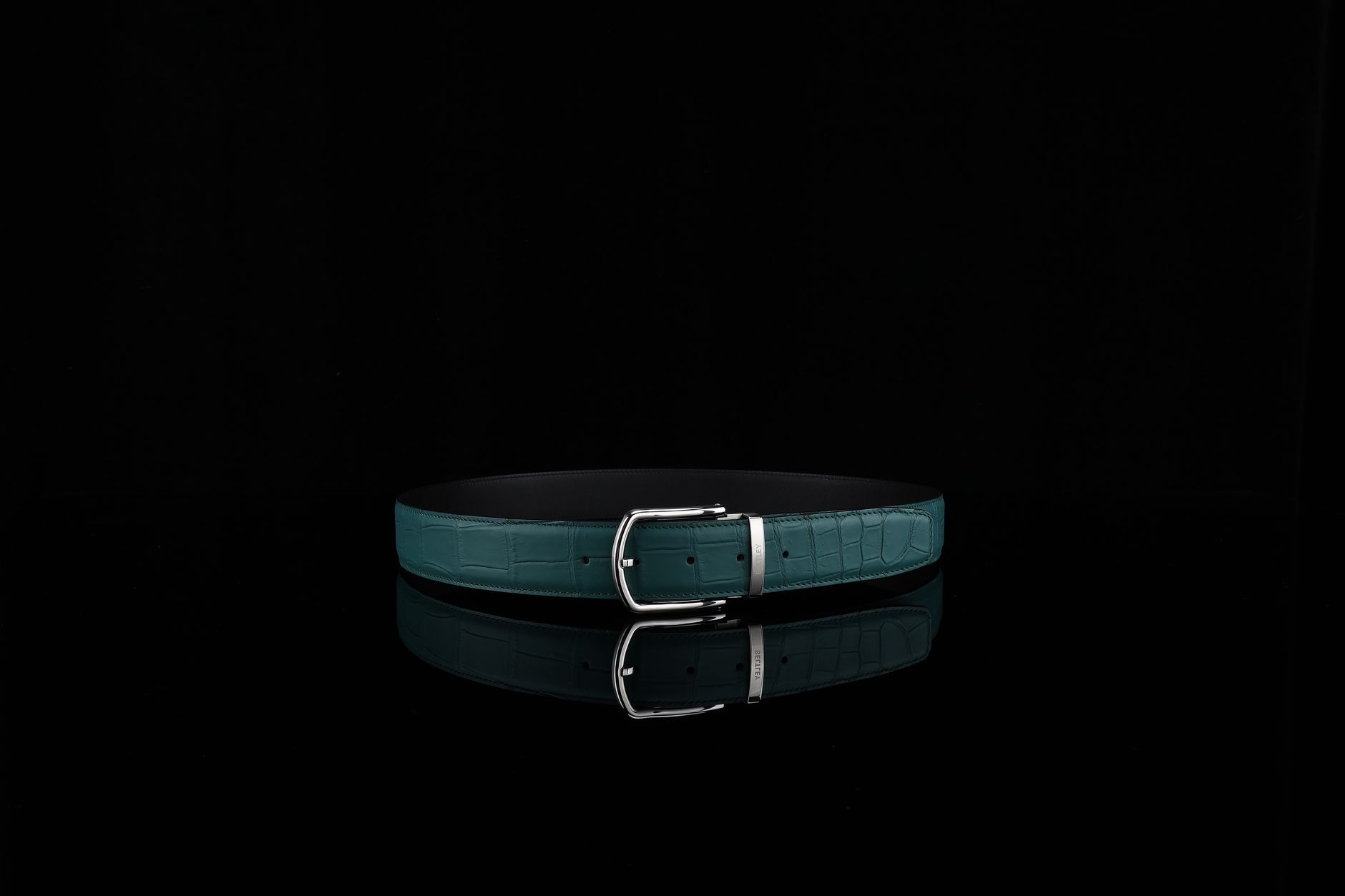 Close-up of a structured minimalist leather belt with clean hardware detail