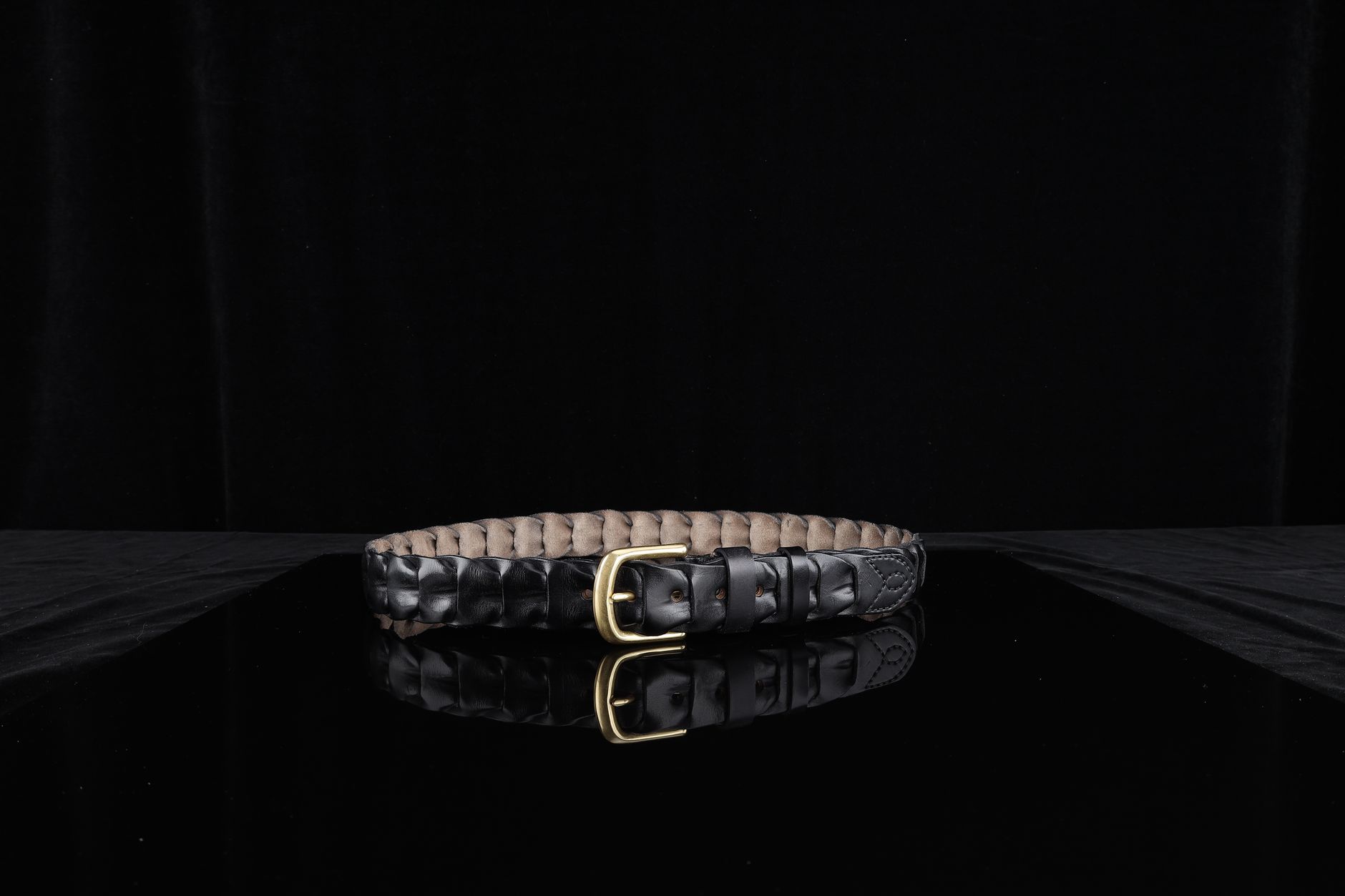 Fashion accessory with visible wrapped leather binding detail at the handle or strap zone