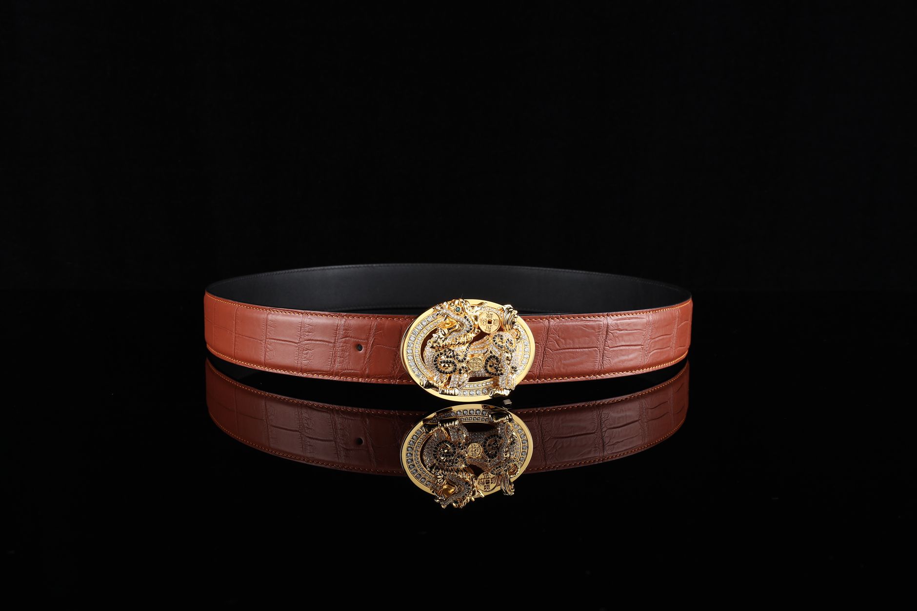 Close-up of brass D-ring and roller buckle hardware on a leather strap