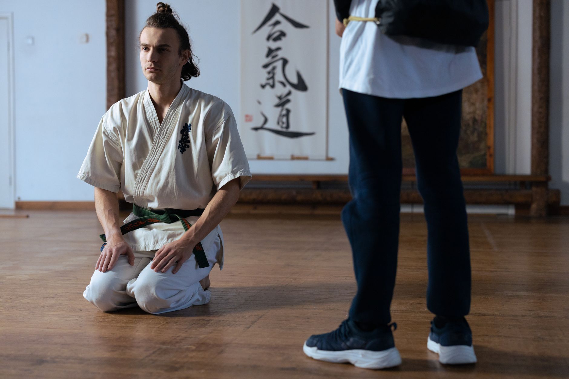 Kendo practitioner wearing traditional men armor showing flat structured shoulder guards