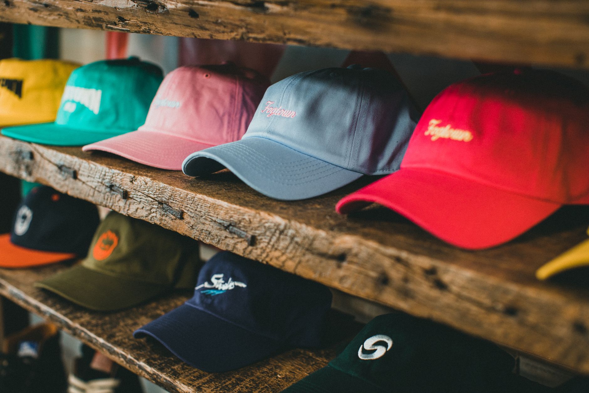 Structured baseball cap with leather peak trim showing stitching detail