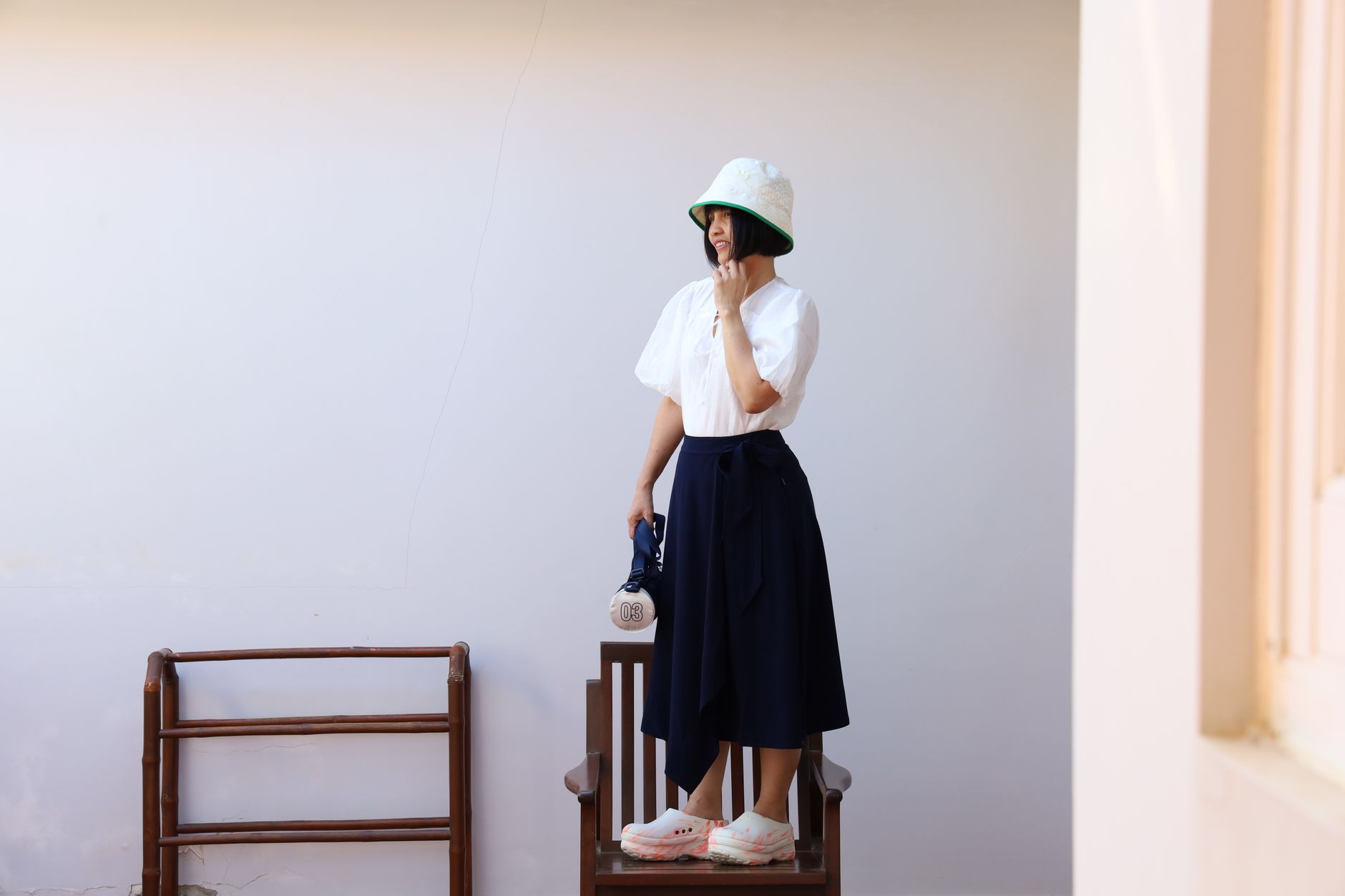Structured midi skirt with panel seaming and tailored silhouette photographed against a neutral background