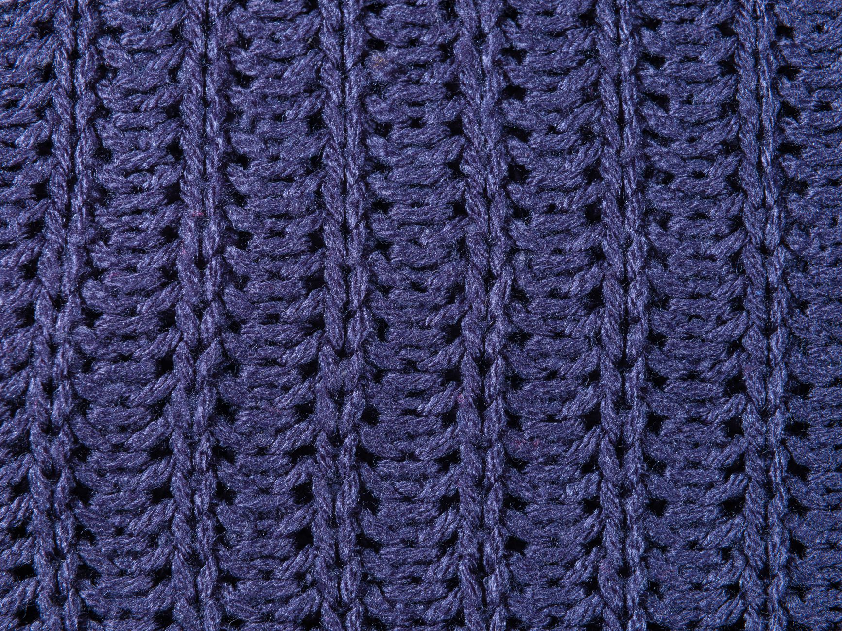 Finished loom-knitted ribbed cuff shown on a wrist, with even stitch texture