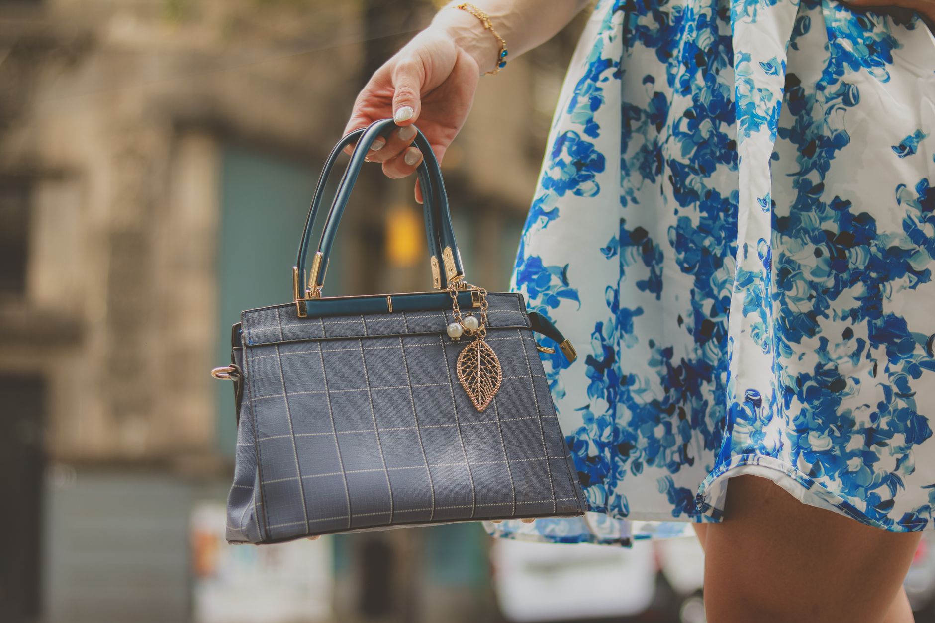 Styled fashion accessories flat lay featuring belts and metal hardware details
