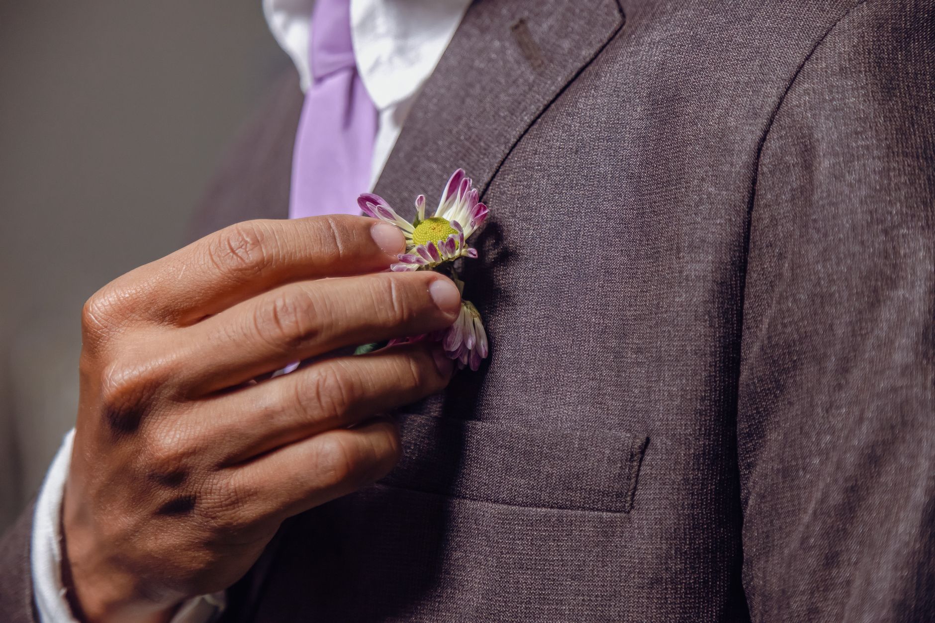 Close-up of a tailored jacket sleeve and underarm seam construction