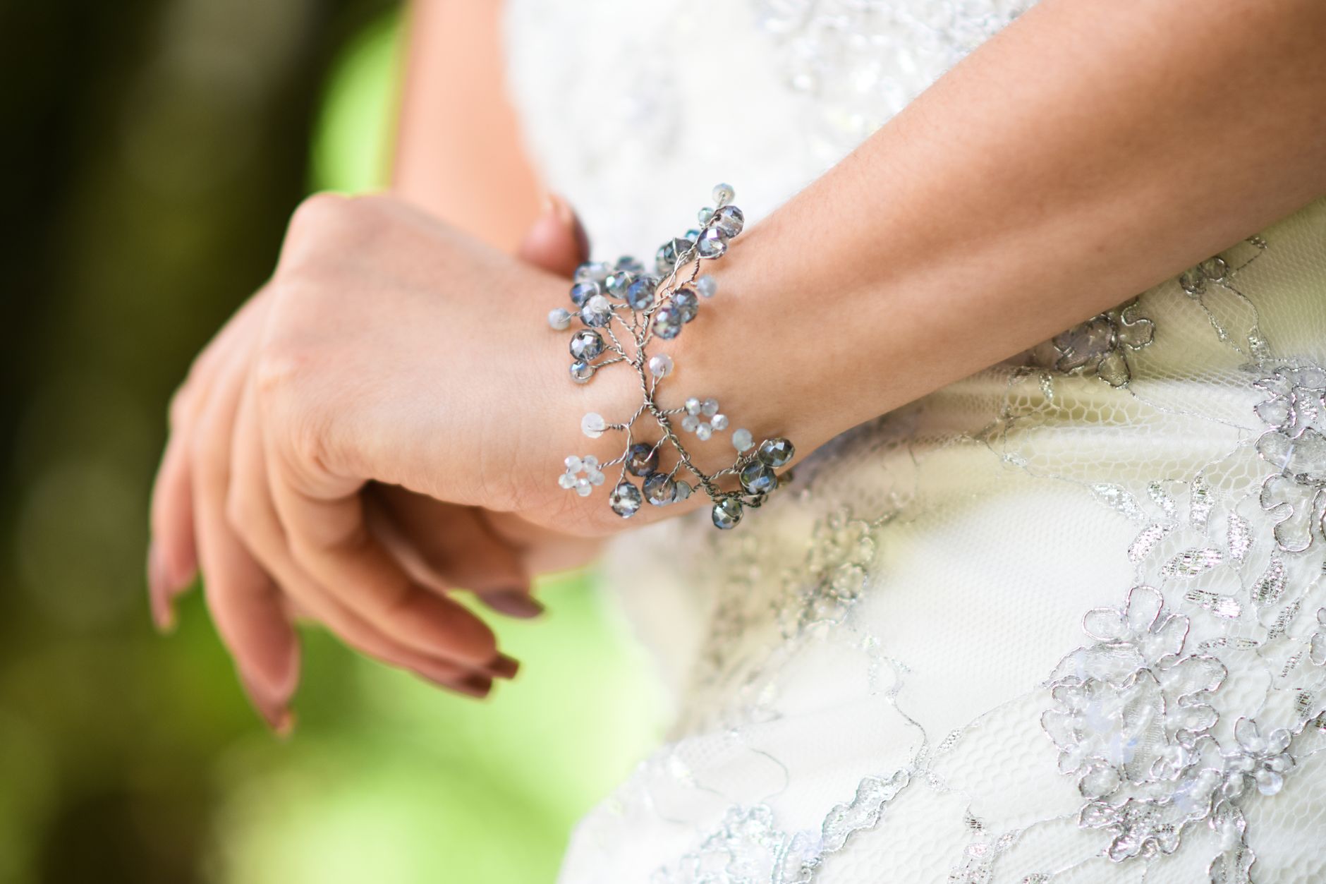 Structured wrist cuff worn against a plain sleeve, photographed close up