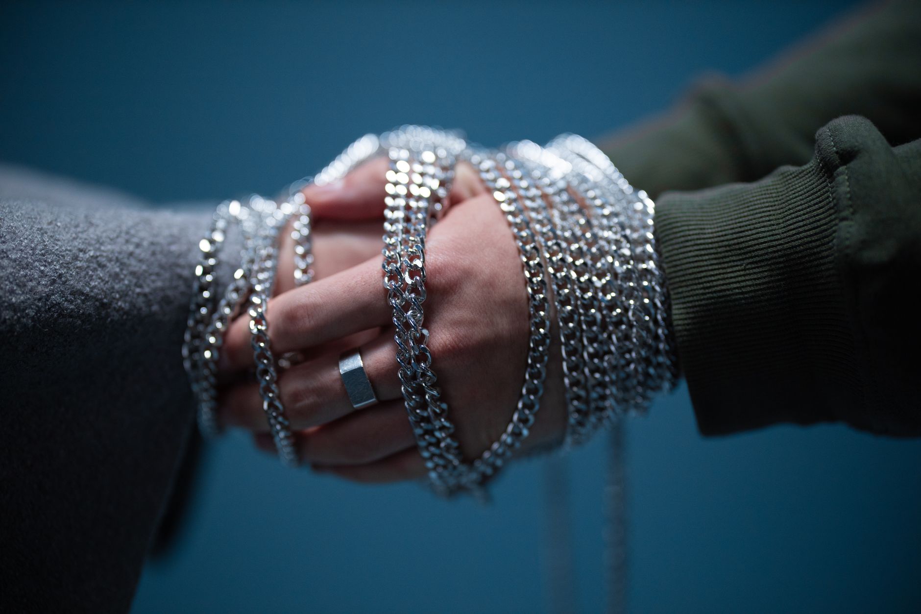 Detailed view of oxidized silver curb chain links showing the flat interlocking link geometry