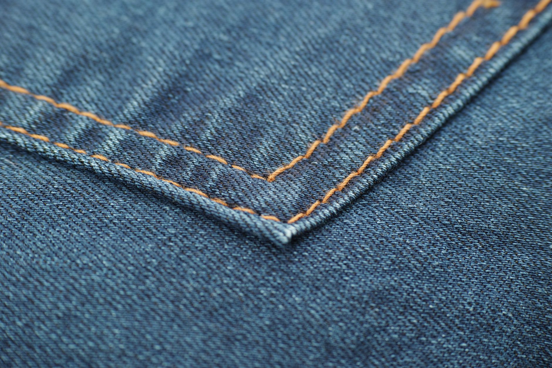Close-up of precise topstitching rows on a structured fabric panel