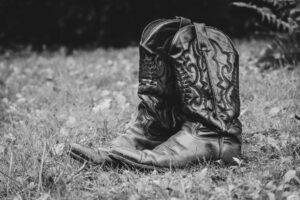 Close-up of structured Western boot toe showing decorative metal hardware detail