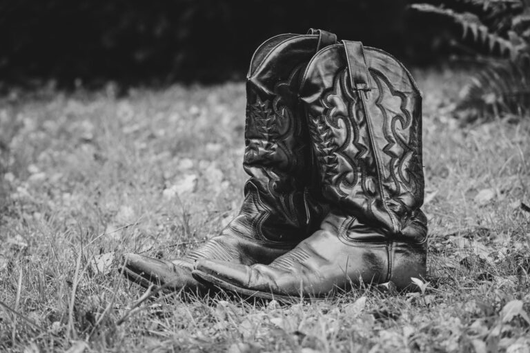 Close-up of structured Western boot toe showing decorative metal hardware detail