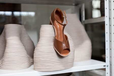 Close-up of minimalist leather sandal straps with clean flat construction and no visible hardware