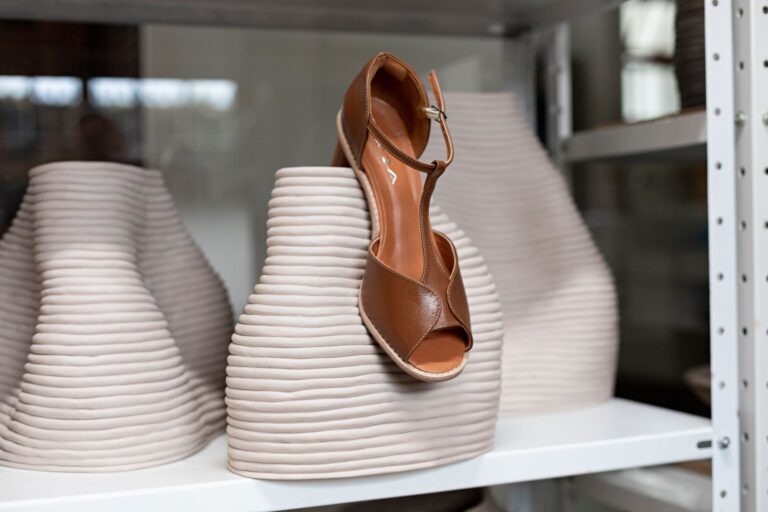 Close-up of minimalist leather sandal straps with clean flat construction and no visible hardware