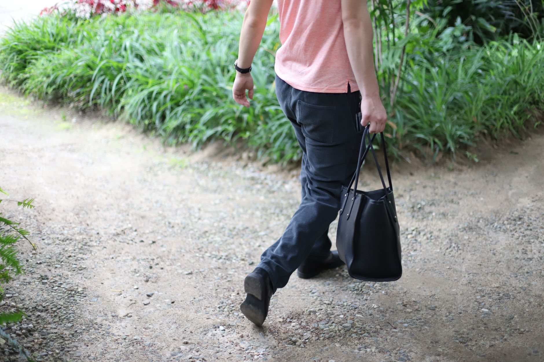 A structured leather tote bag with a defined base and clean exterior lines