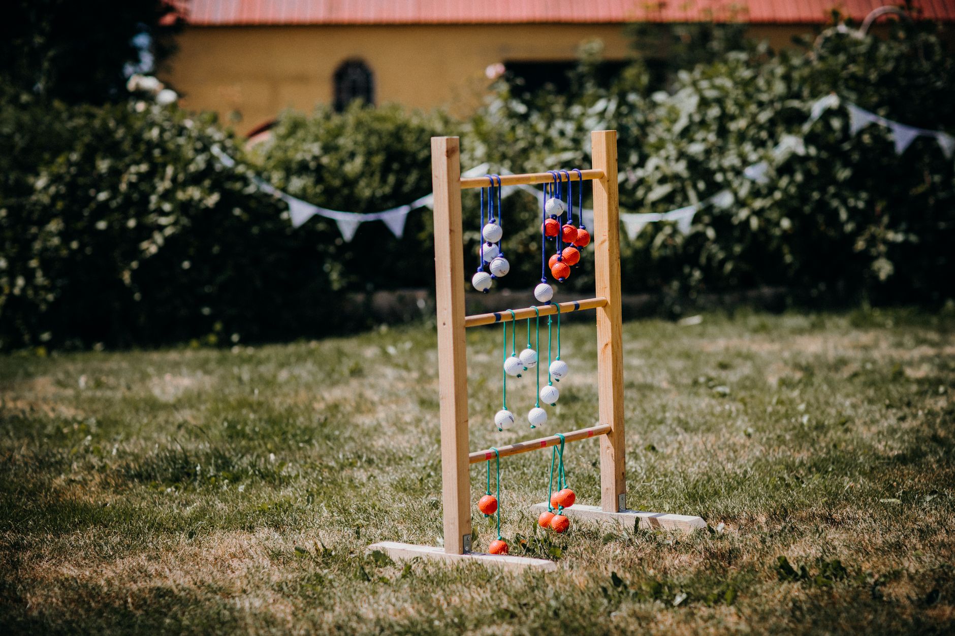 Croquet mallets and chalk markings on a green garden lawn on a sunny afternoon