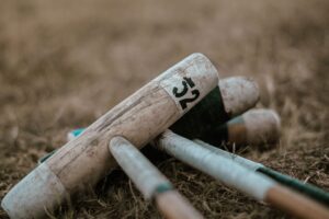 Croquet Mallet Shaft Lacquer Rings Are Quietly Banding Minimalist Ring Stacks Close-up of a wooden croquet mallet shaft showing banded lacquer rings near the handle