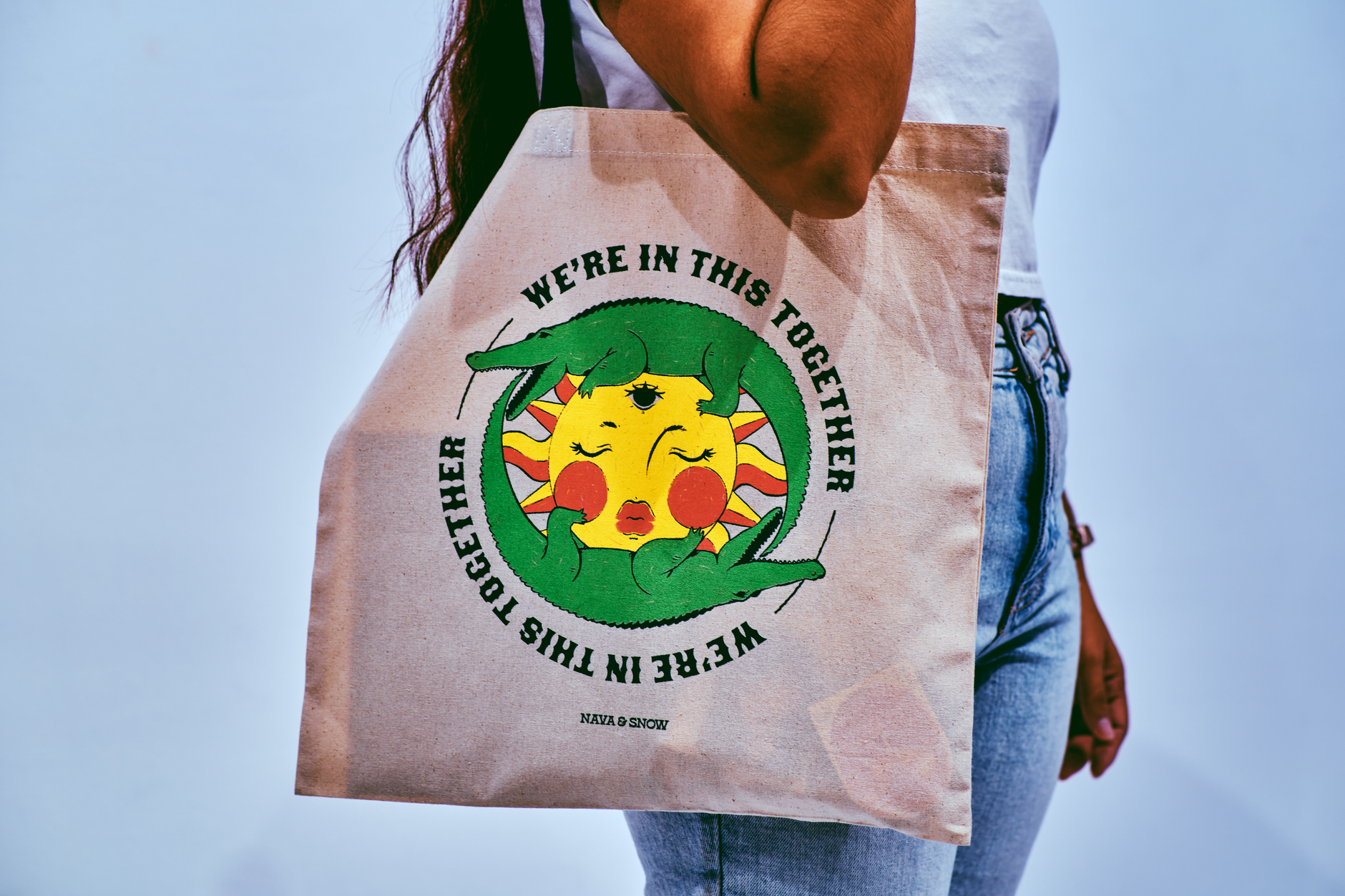 Structured canvas tote bag with reinforced base stitching sitting on a flat surface
